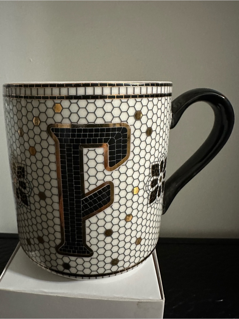 Anthropologie White Ceramic Mug with Black Handle and Gold Accents